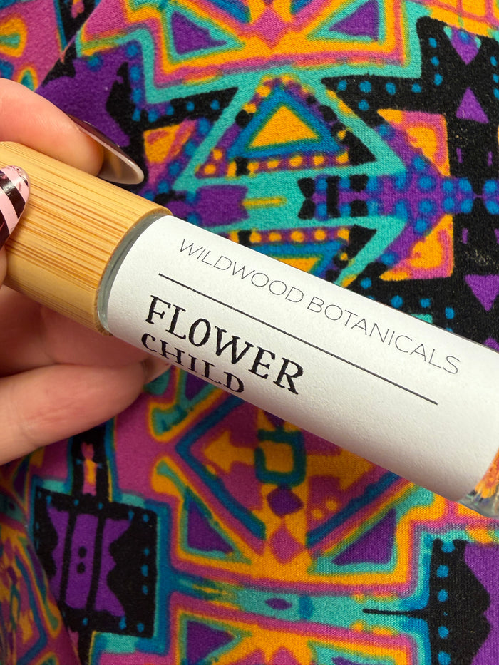 Wildwood Botanicals rollerball perfume bottle with clear glass and elegant label, showcasing a natural floral fragrance.