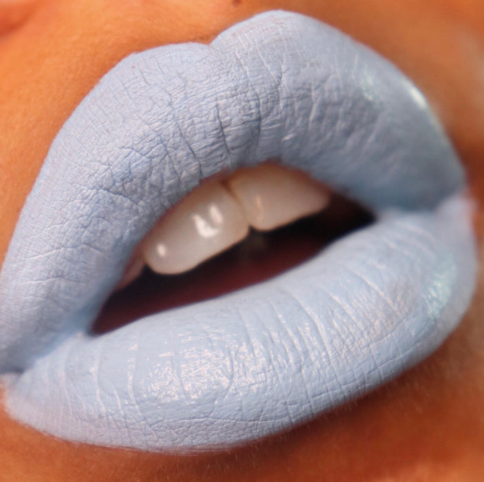 close up of lips wearing absolution gothic lipstick a baby pastel goth blue