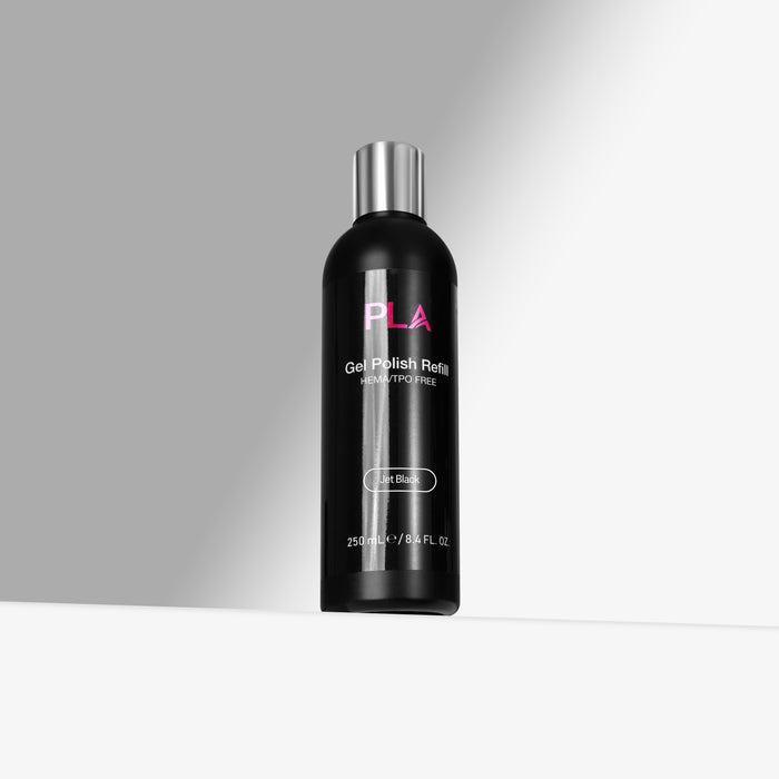 Black bottle with silver cap labeled 'PLA' on a gray background