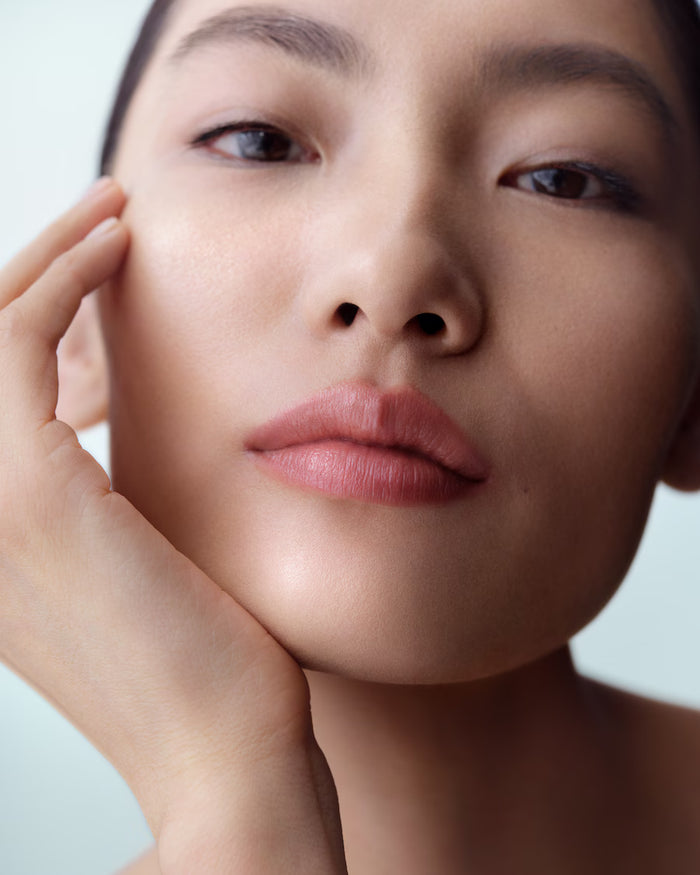 La Mer The Lip Treatment in various shades, new in box, showcasing glossy lip balms with smooth, hydrating textures.