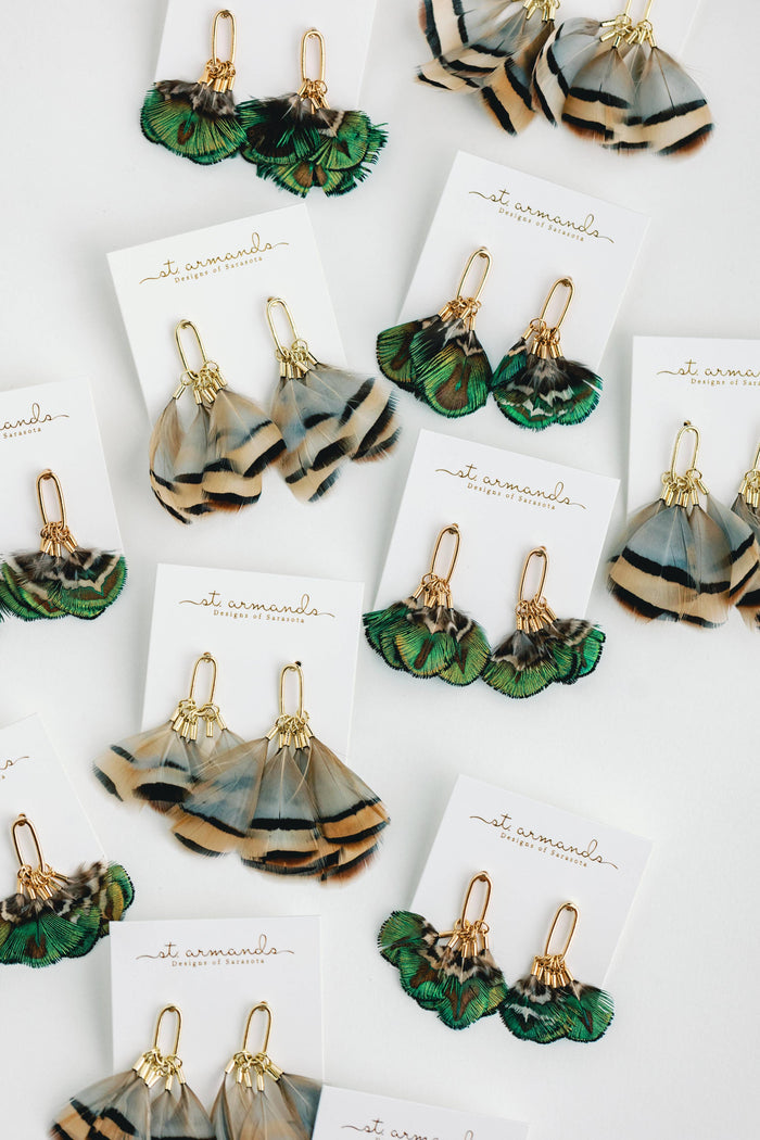 Mallard feather tassel earrings by St Armands Designs of Sarasota featuring natural feather tassels and elegant dangle style.