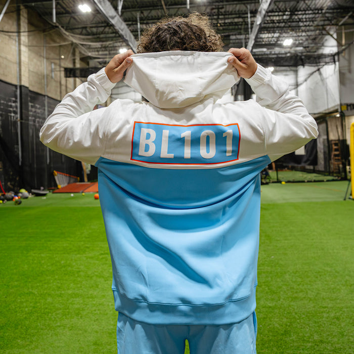 Adult model wearing multi-color hoodie with "UVChangeup Trash Talk" design