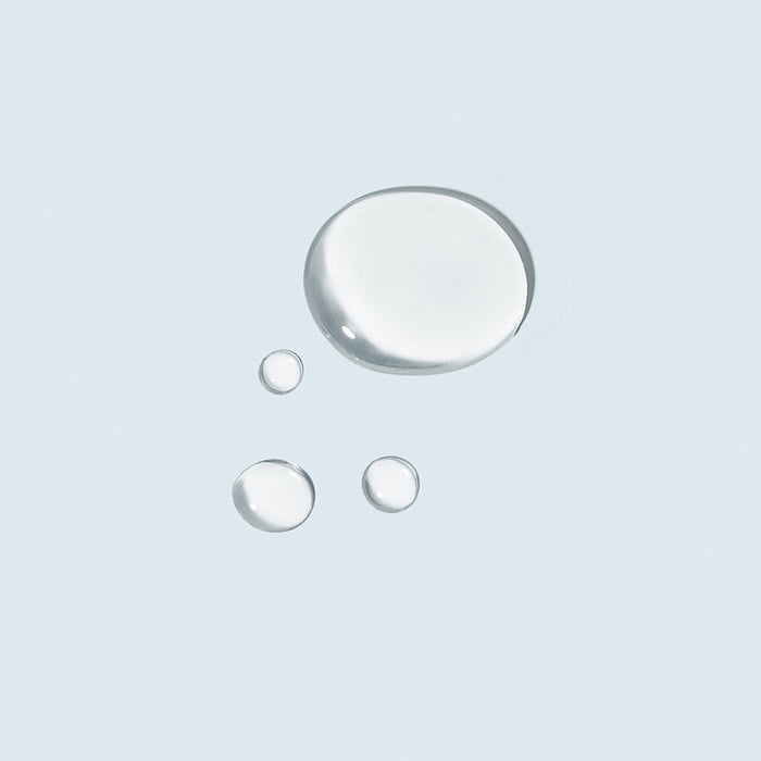 tizo advanced vitamin c + e serum product swatch on light blue background.