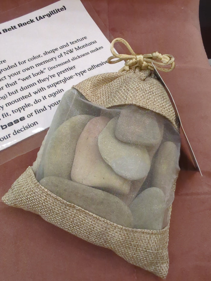 Pleistoscene Belt Rock satchel of stones art piece featuring a collection of natural stones arranged in a decorative satchel style.