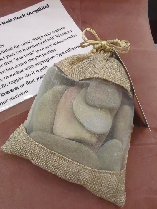 Pleistoscene Belt Rock satchel of stones art piece featuring a collection of natural stones arranged in a decorative satchel style.