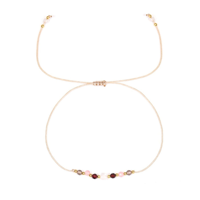 Capricorn Bracelet with small beads on a white background