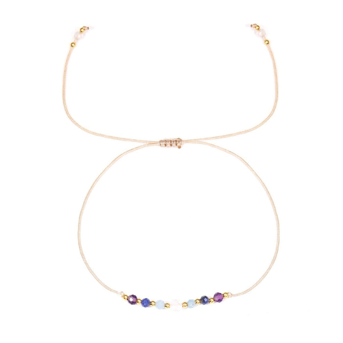 Bracelet - Zodiac, Pisces with small colorful beads on a white background