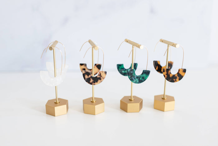 Brown tortoise minimalist threader earrings by St Armands Designs of Sarasota hanging on a display.