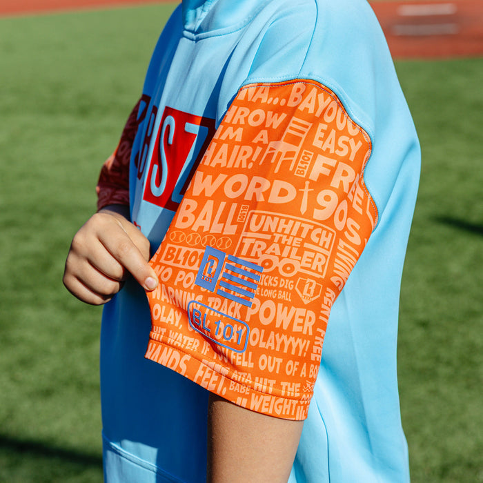 Youth model wearing blue youth short sleeve hoodie with "BSBL-SZN V3 Short Sleeve Youth" design