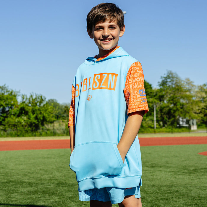 Youth model wearing blue youth short sleeve hoodie with "BSBL-SZN V3 Short Sleeve Youth" design