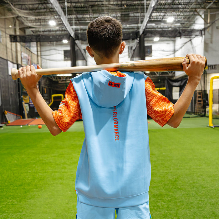 Youth model wearing blue youth short sleeve hoodie with "BSBL-SZN V3 Short Sleeve Youth" design