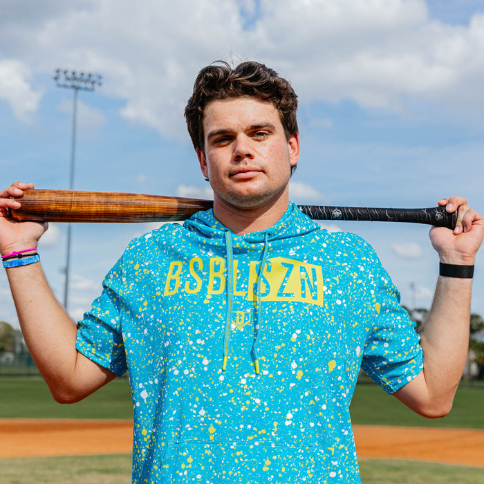 Adult model wearing blue BSBL-SZN Splatter Highlighter short sleeve hoodie