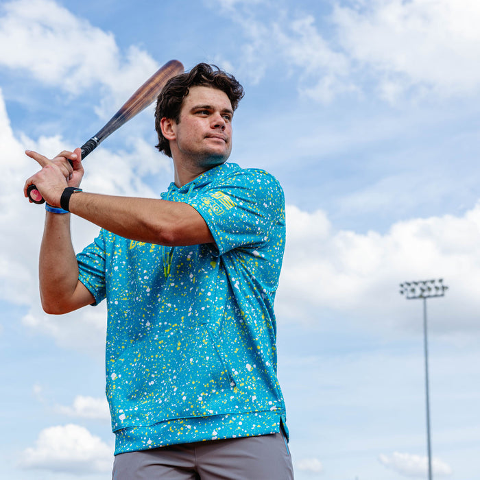 Adult model wearing blue BSBL-SZN Splatter Highlighter short sleeve hoodie