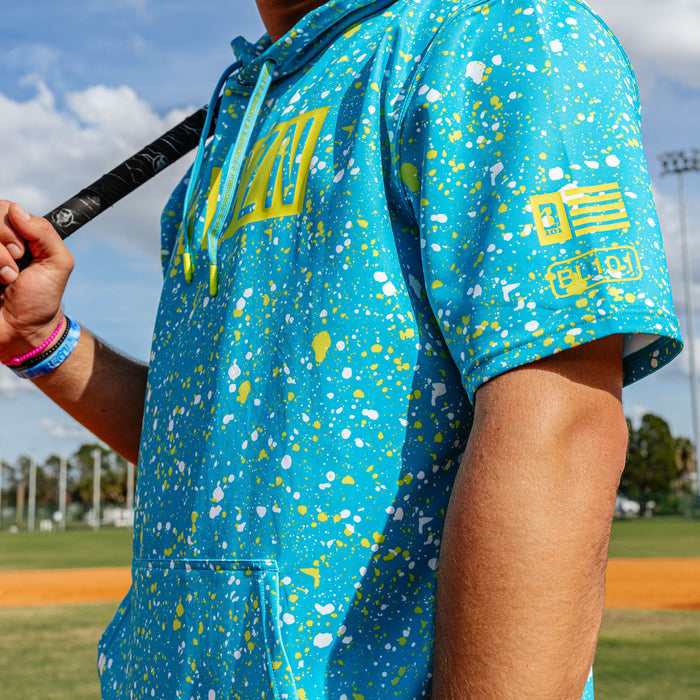 Adult model wearing blue BSBL-SZN Splatter Highlighter short sleeve hoodie