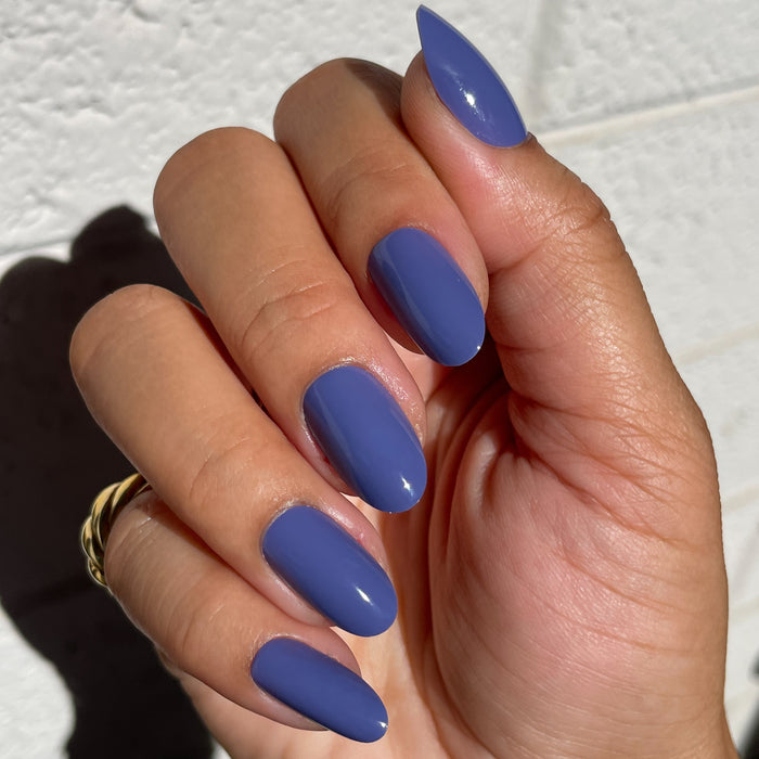 CNH | Oval | Medium blue oval press-on nails with a glossy finish for an easy, stylish at-home manicure look