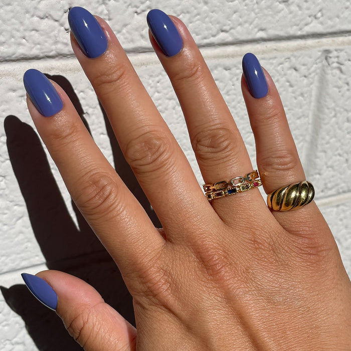 CNH | Oval | Medium medium blue oval press-on nails with a smooth glossy finish for an effortless at-home manicure look