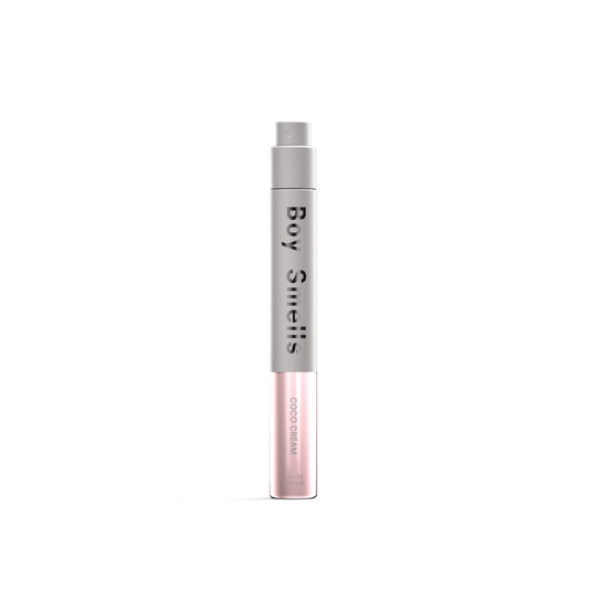 Slim roller fragrance bottle with pink frosted body and silver cap