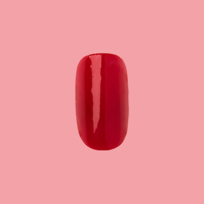 CV - Press-On | Medium | Squoval bright cherry red false nail with glossy finish on solid pink background