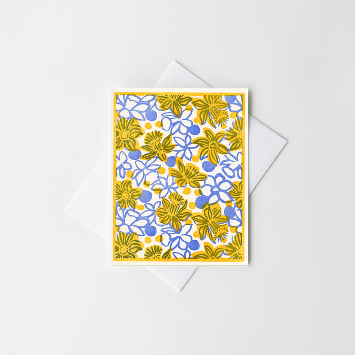 Floral letterpress greeting card with yellow and blue daisy-like flowers