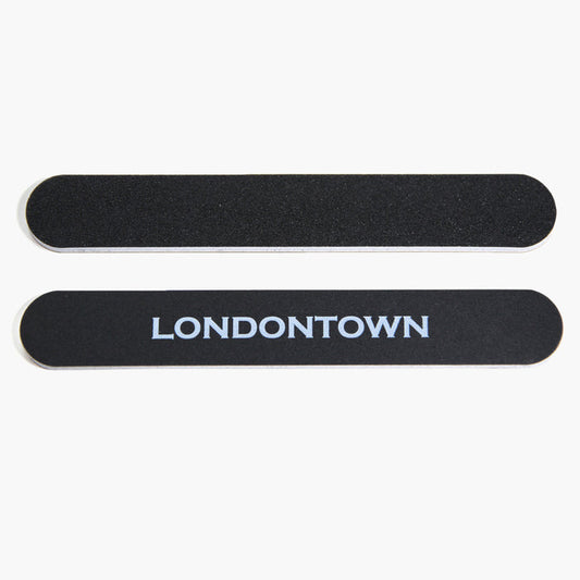The LONDONTOWN Emery Board Nail File set includes two black, durable emery boards with rounded edges. One board features the brand name "LONDONTOWN" in white capital letters. Perfect for everyday use at home or on the go.