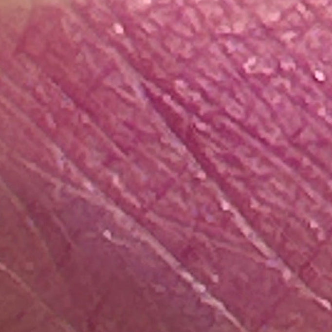 Ghost Orchid frosted lipstick swatch on skin in cool pink orchid shade