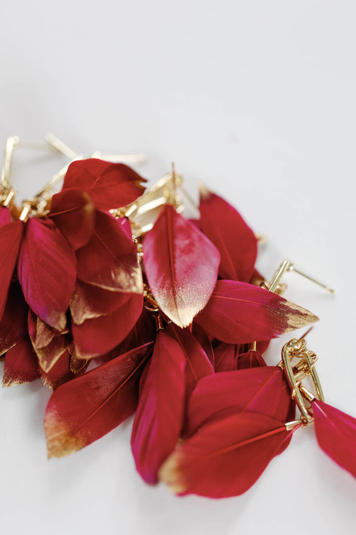 Gold dipped garnet feather earrings with fall-inspired design from St Armands Designs of Sarasota.