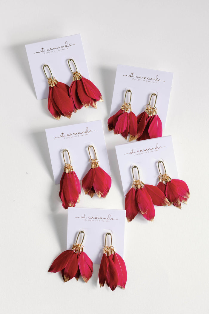 Gold-dipped garnet feather earrings by St Armands Designs of Sarasota, featuring fall-inspired feather design and statement style.