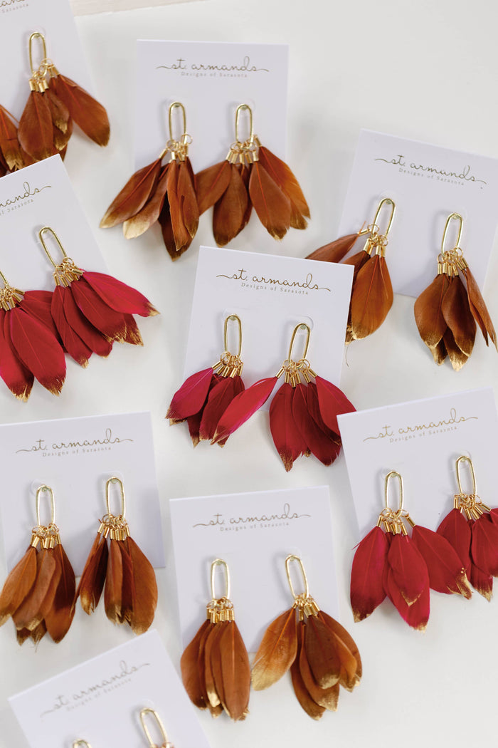Gold dipped garnet feather earrings by St Armands Designs of Sarasota featuring fall-inspired feather dangle jewelry