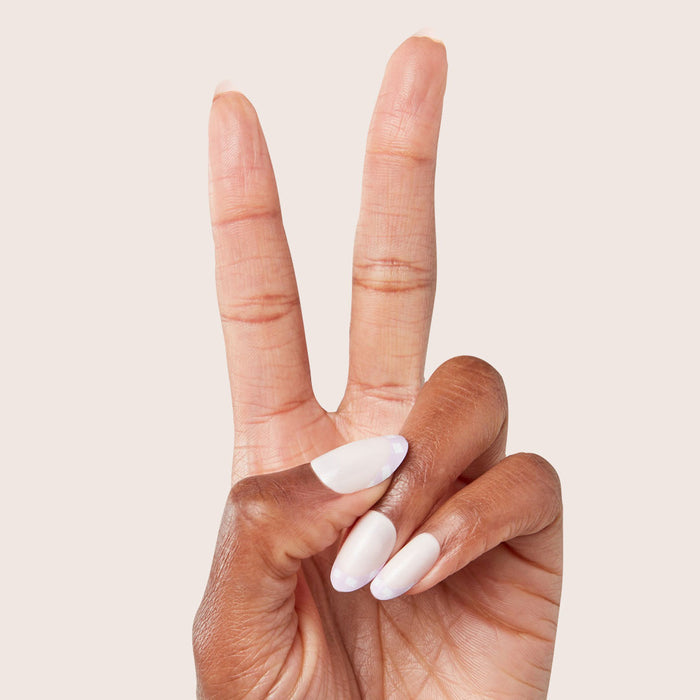 Hand showing Gingham French - Press-On | Medium | Oval with soft lavender gingham tips and medium oval shape manicure