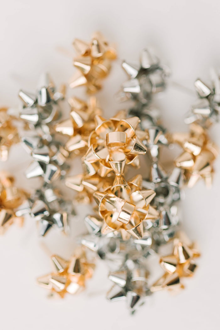 Gold Present Bow Earrings by St Armands Designs of Sarasota featuring festive gift bow-shaped jewelry with polished gold finish.