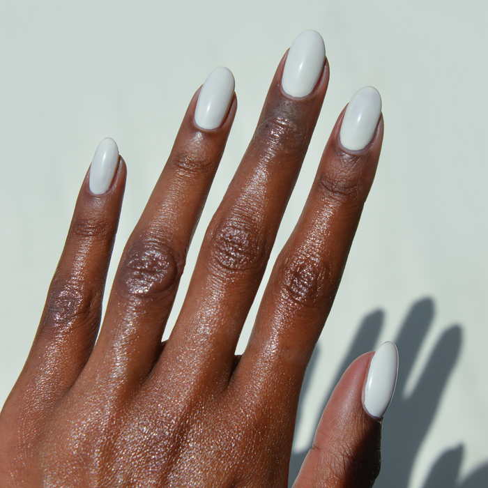 Icing on the Cake cream nail polish manicure on a deep skin tone