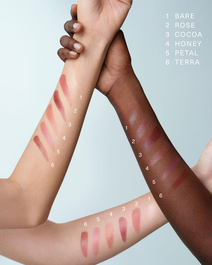 La Mer The Lip Treatment in various shades, new in box, showcasing sleek packaging and different color options for nourishing lips.