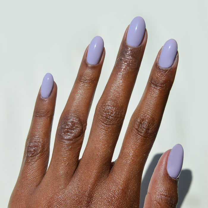 Lavender Drop pastel lavender nail polish manicure on a deep skin tone