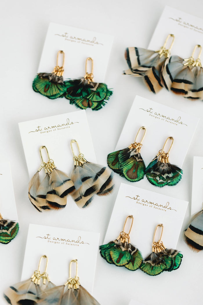 Mallard feather tassel earrings featuring natural feather details and gold-tone hooks, designed by St Armands Designs of Sarasota