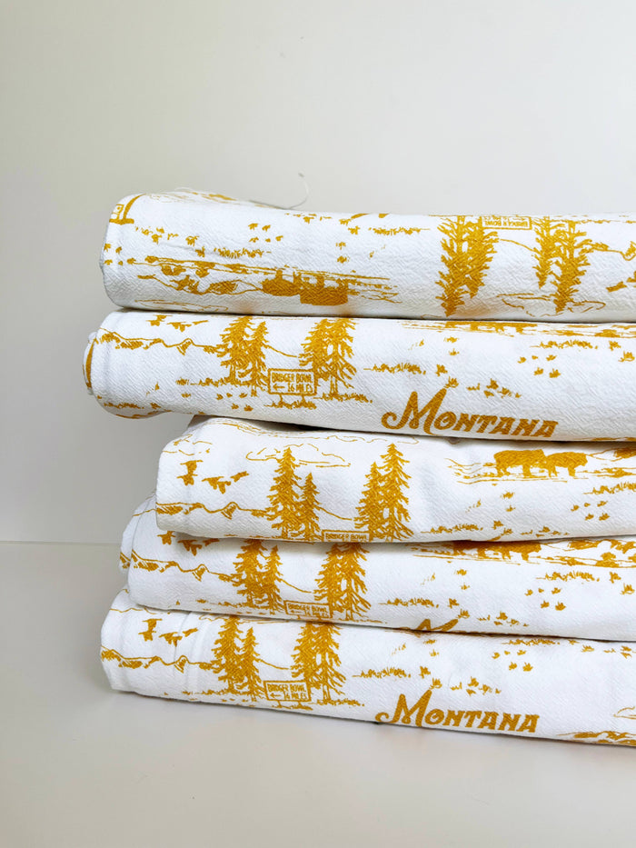 Montana Scenes cotton kitchen towel by The Coin Laundry featuring colorful Montana landscape design.