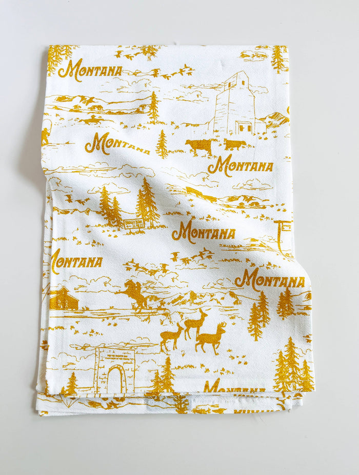 Montana Scenes cotton kitchen towel featuring scenic mountain landscape, soft fabric, and decorative design by The Coin Laundry.