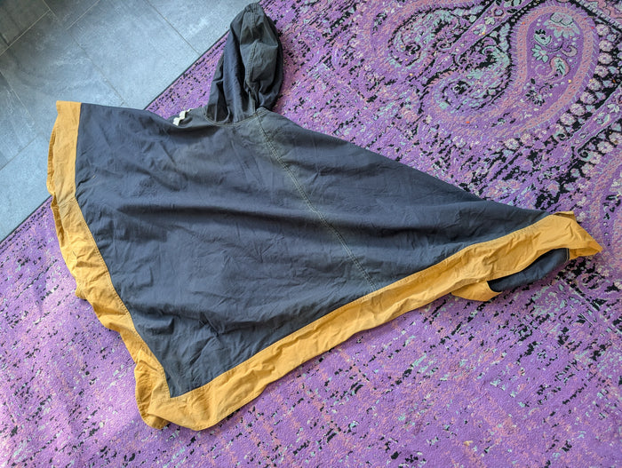 PONCHO/ CASE PURSE- NEOTROPOLIS DELIVERY OPTIONAL!