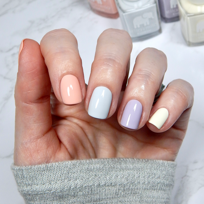 Royal Tea pastel blue with peach, lilac and cream mix-and-match manicure