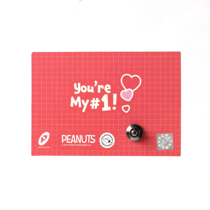 Valentine pin card back with red grid, "You’re My #1" hearts, and PEANUTS logos