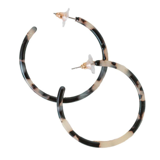 Skinny blonde tortoise hoop earrings by St Armands Designs of Sarasota, featuring lightweight, stylish tortoise-patterned jewelry.