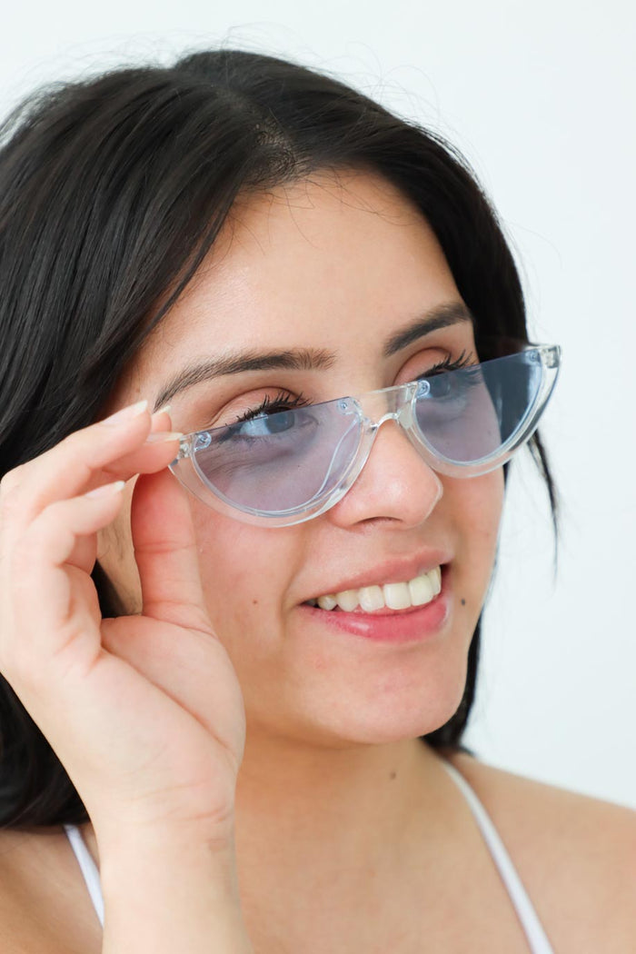 girl wearing blue acrylic sunglasses