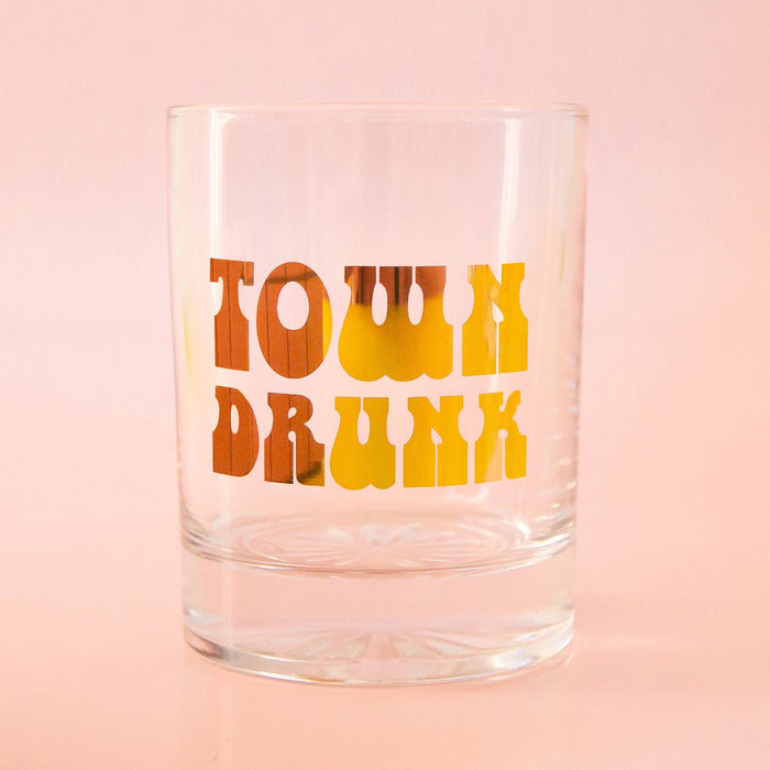 Gold Town Drunk Tumbler by Sunshine Studios, glassware with a detailed town drunk design, showcasing its elegant glass construction.