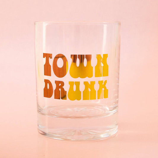 Gold Town Drunk Tumbler by Sunshine Studios, glassware with a detailed town drunk design, showcasing its elegant glass construction.