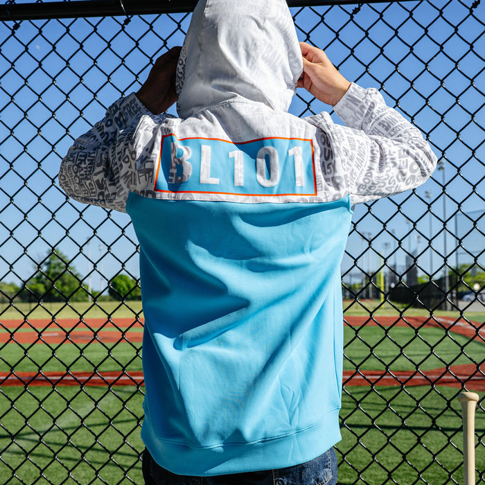 Adult model wearing multi-color hoodie with "UVChangeup Trash Talk" design