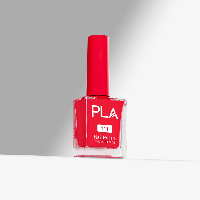 Red nail polish bottle with 'PLA' branding on a gray background